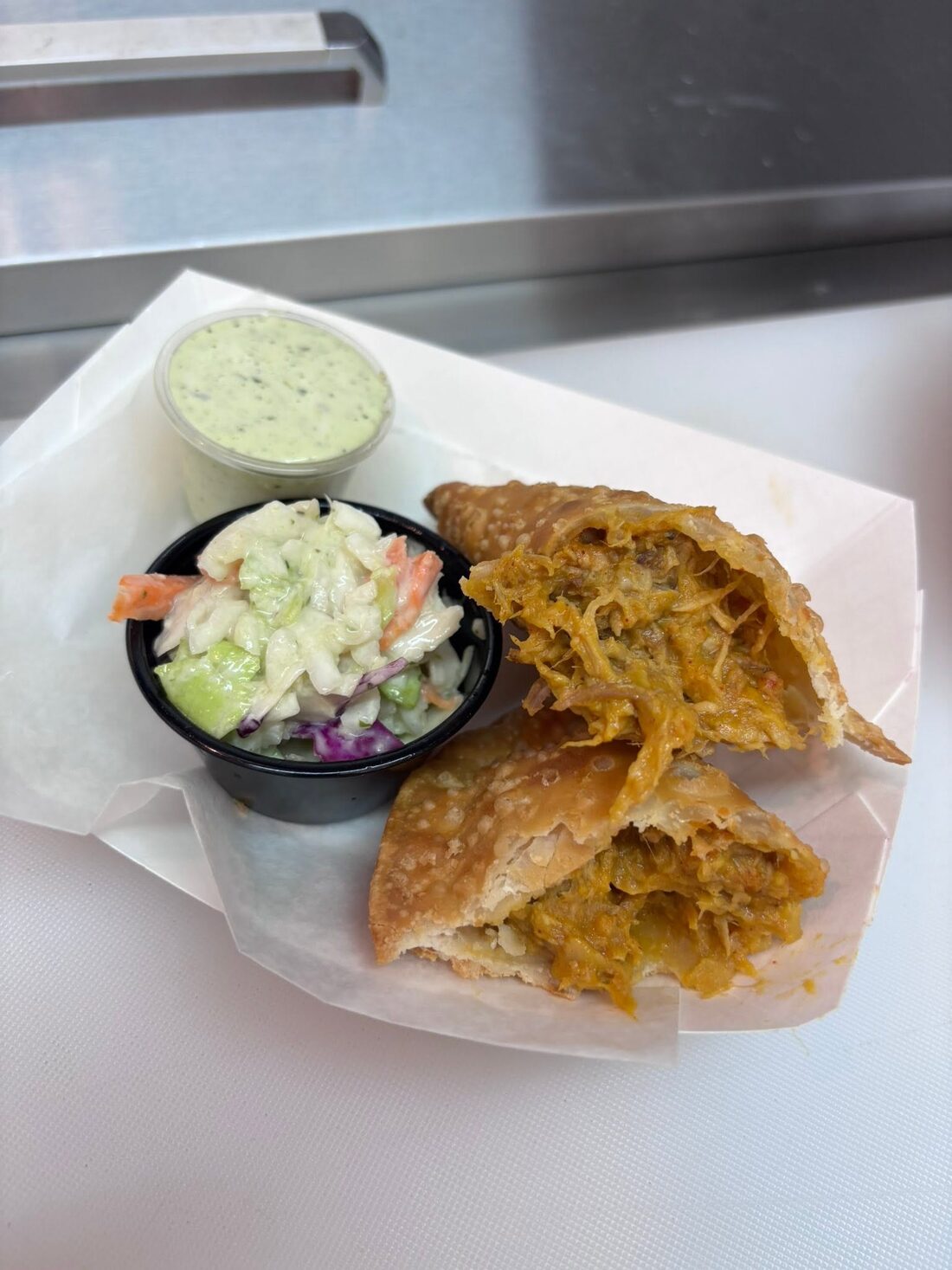 Empanada and rice combo tray